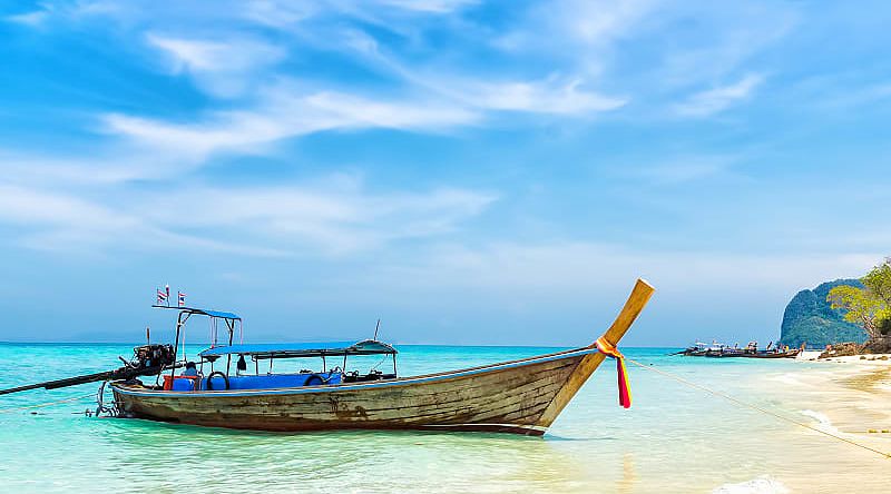Fishing boat on the white sandy beach of Koh Samui island, Thailand