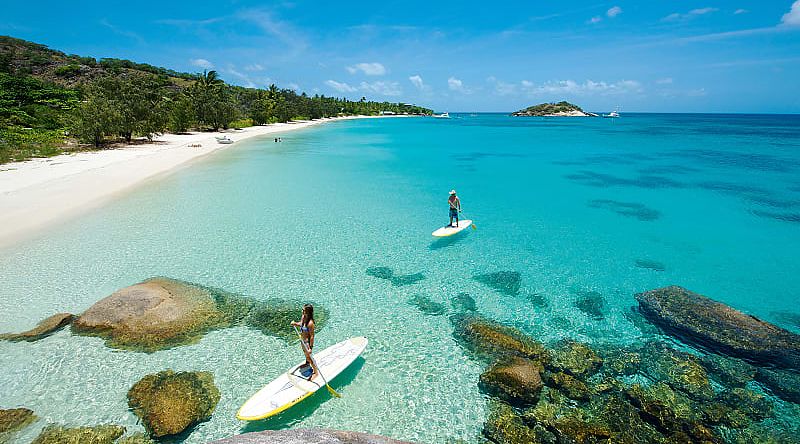 Couple paddle boarding at Lizard Island