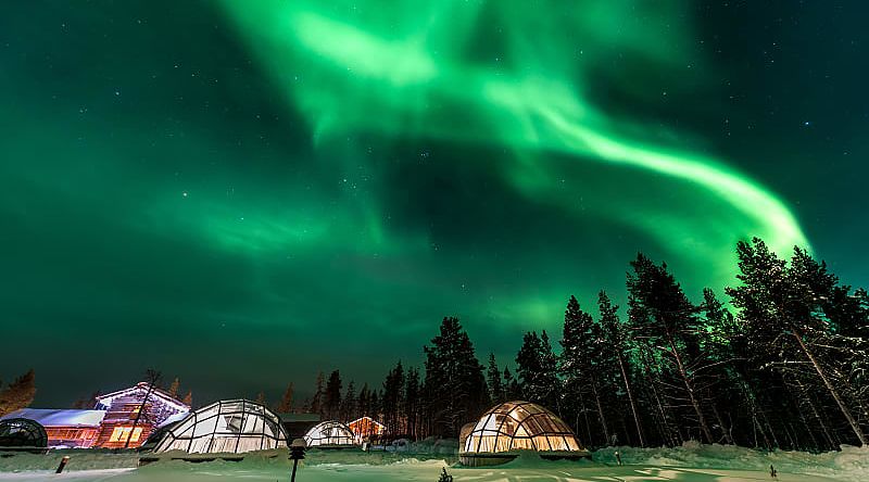 Aurora Borealis above igloos in Finland