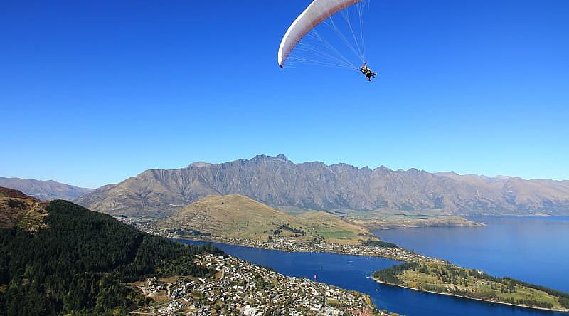 Hang glider over Queenstown South Island, New Zealand Hang glider over Queenstown South Island, New Zealand