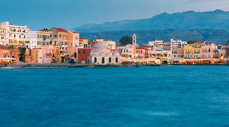 Chania in Crete, Greece Venetian Quay of Chania with Kucuk Hasan Pasha Mosque during twilight blue hour, Crete, Greece