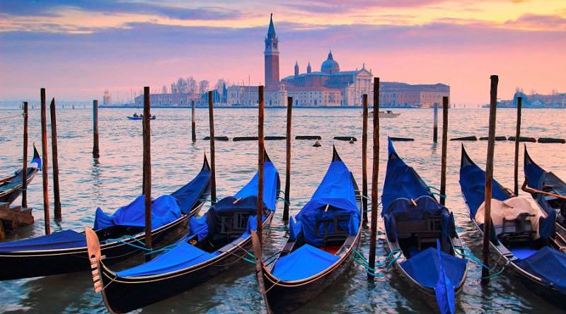 blue gondolas on water in venice