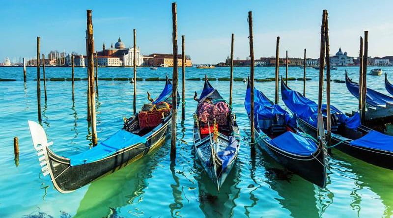 Gondolas on Venice canal in Italy Gondolas on Venice canal in Italy