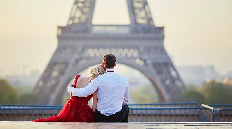 Couple overlooking the Eiffel Tower in Paris, France