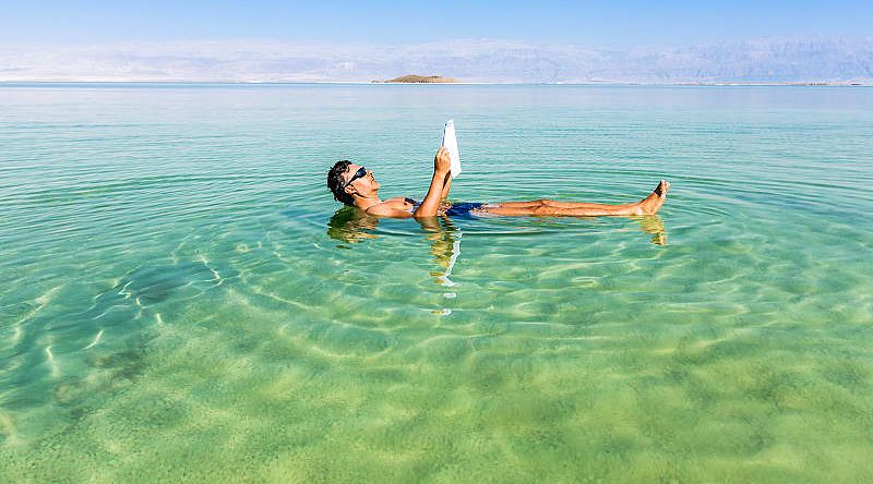 Tourist floating on the Dead Sea in Israel