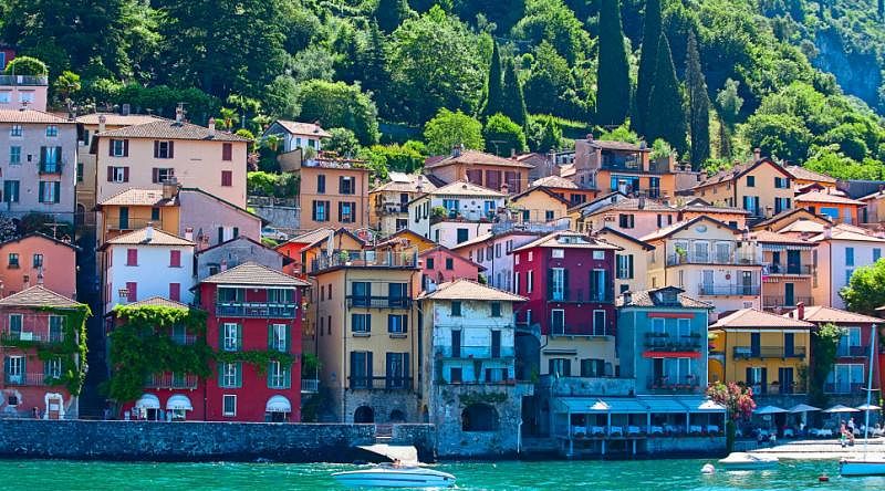 Colorful houses on a hillside bordering Lake Como in Lombardy, Italy Colorful houses on a hillside bordering Lake Como in Lombardy, Italy