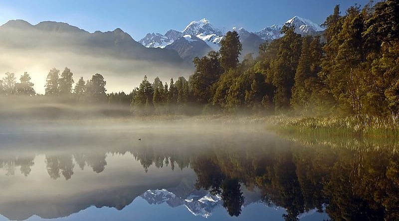 Morning fog over Lake Matheson and Mount Cook, New Zealand Morning fog over Lake Matheson and Mount Cook, New Zealand