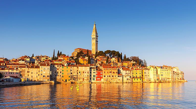 Seniors Trip to Croatia - Rovinj Seafront town of Rovinj with houses and church tower