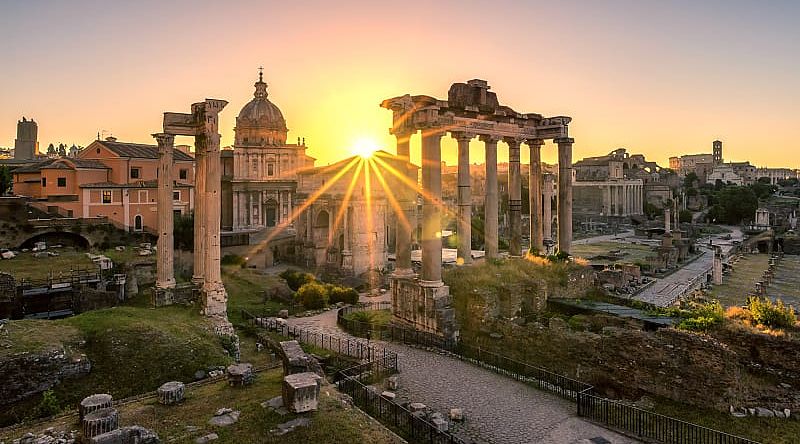 Sun rising over Roman ruins in Italy