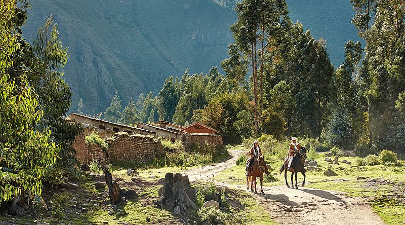 Couple horseback riding in the Urubamba Valley. Photo courtesy of Rio Sagrado, A Belmond Hotel Couple horseback riding in the Urubamba Valley