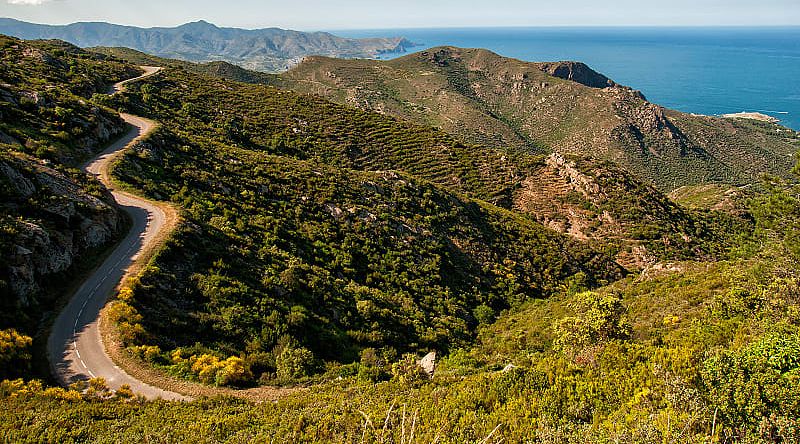 Winding road through mountains in the coast of Cap de Creus, on the way to Girona, Spain, Winding road through mountains in the coast of Cap de Creus, on the way to Girona, Spain,