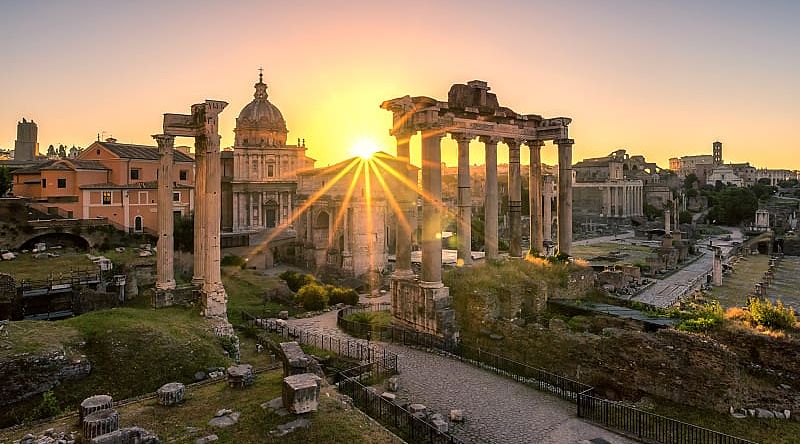 Sun rising over Roman ruins in Italy