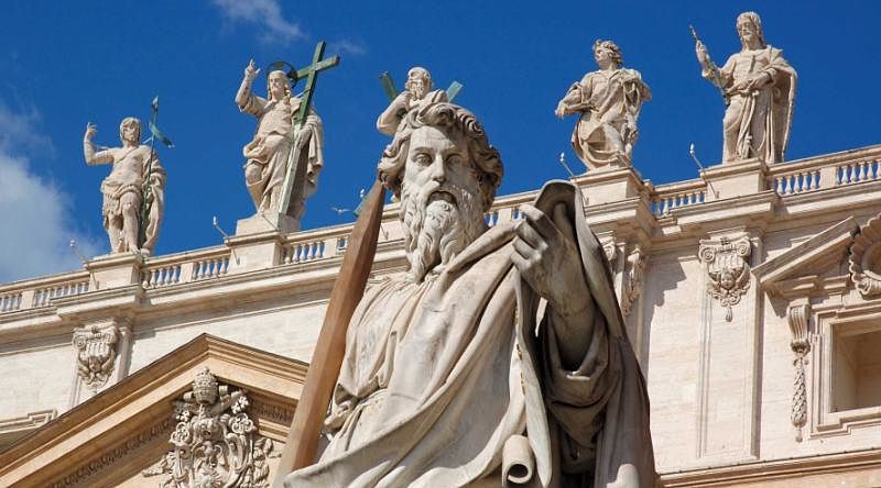 Statues of saints on top of St. Peter's Basilica in Rome, Italy