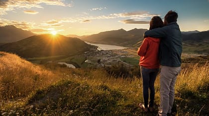 Couple enjoying a sunset in New Zealand 