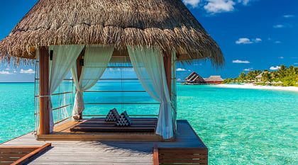 Bungalows over turquoise water in Bora Bora