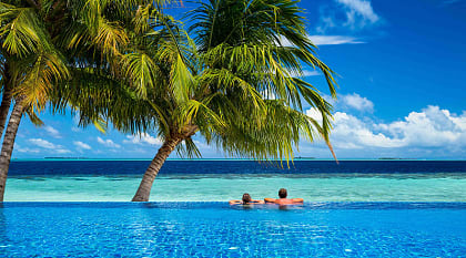Couple in the pool at beach resort in Mauritius 