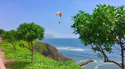 People paragliding in Miraflores, Lima, Peru.