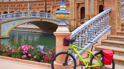 Touring bicycle parked at Plaza de España in Seville, Spain