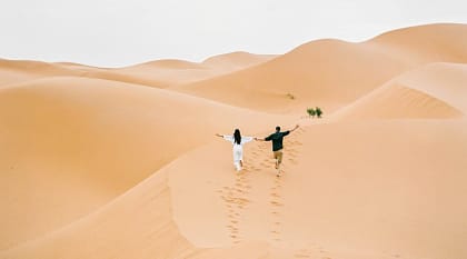Couple at the Sahara desert in Morocco