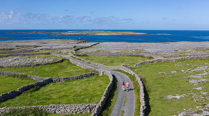 Couple walking on Inishmore, Aran Islands, County Galway