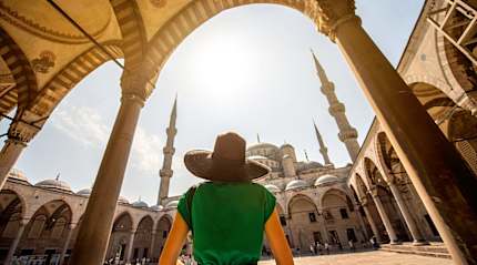 Woman visiting the Blue Mosque in Istanbul, Turkey