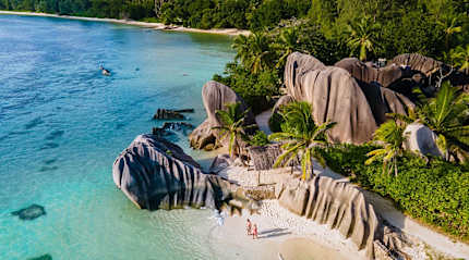 Couple at Anse Source d'Argent Beach on La Digue Island, Seychelles
