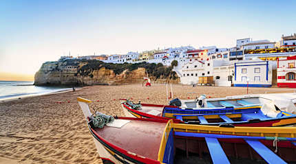Beautiful beach with colorful boats in Carvoeiro in the Algarve region of  Portugal