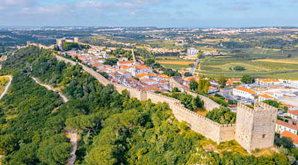 Panorama of the hilltop town of Obidos surrounded by medieval wall