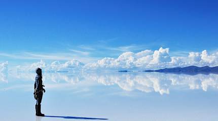 Woman with camera at Salar de Uyuni in Bolivia