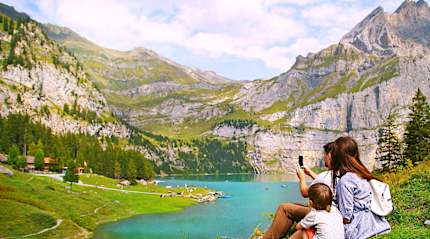 Family photographing nature in Switzerland