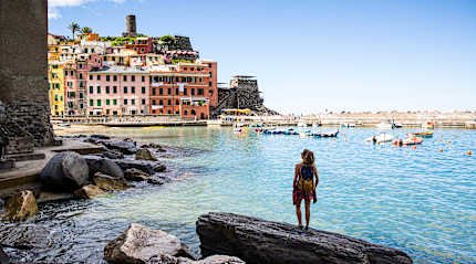 Woman looking out to sea in Vernazza, Cinque Terre.