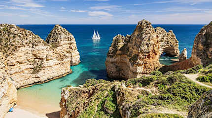 Sailing the beautiful blue bay near Lagos, in the Algarve region in Portugal