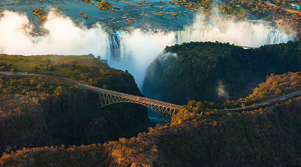 Aerial view of Victoria Falls: feel the misty spray and hear the roaring cascades of the 'Smoke That Thunders.