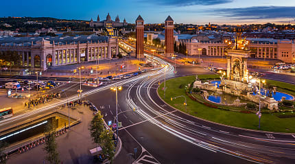 Traffic circling Placa d'Espanya in Barcelona, Spain.