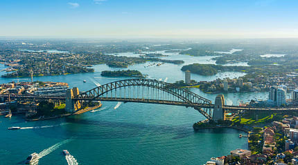 Australia’s iconic Harbour Bridge in Sydney showcases the vibrant city.