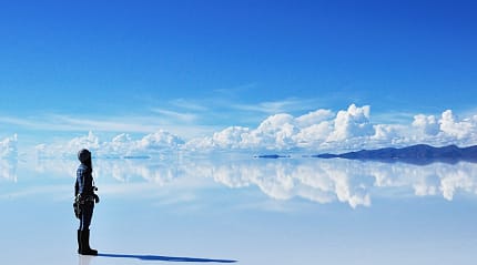 Woman with camera at Salar de Uyuni in Bolivia