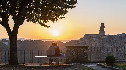 Couple in Pitigliano at sunset Tuscany, Italy