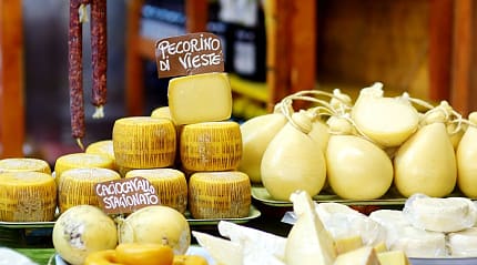 Large selection of cheeses in Italian market