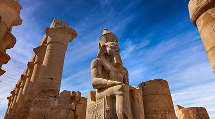 Stone statue of Ramses II at Karnak Temple in Luxor, Egypt