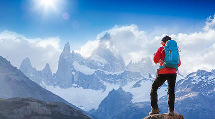 Hiker stopping to admire Mount Fitz Roy in Patagonia