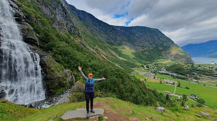 Olena at a waterfall in Flåm, Norway