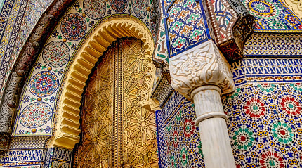 Intricate tile patterns, metal work and plaster carvings in Fez, Morocco