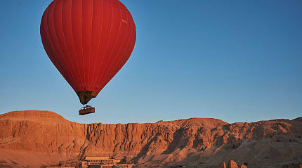 Hot air balloon over Asasif Valley and the Temple of Hatshepsut in Luxor, Egypt