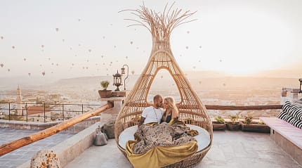 Couple in Cappadocia enjoying the sunrise in Turkey
