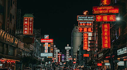 Neon-lit Chinatown street where Southeast Asia's street food culture thrives
