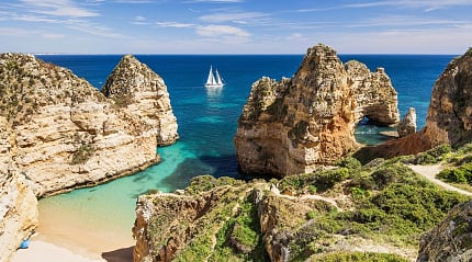 Sailing the beautiful blue bay near Lagos, in the Algarve region in Portugal