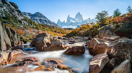 Stream and autumn colors in El Chalten with Fitz Roy mountain in Argentina