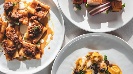 Three dishes of various Italian foods