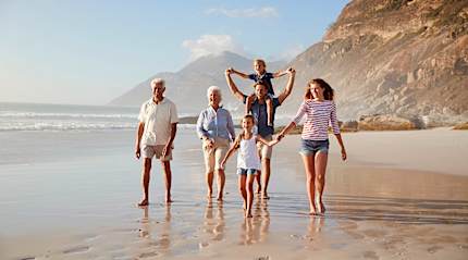 Family on Cape Town beach where curiosity is activated rather than managed.