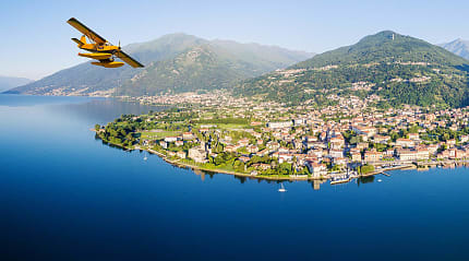 Seaplane flying over Lake Como in Italy.